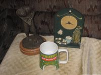 All three golf themed items grouped on surface