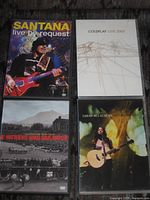 Front covers of all four concert DVDs arranged in grid