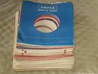 Stack of sleeves topped with blue Ampex Music of Canada sleeve