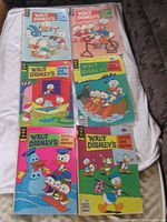 All six comic books laid out to show fronts