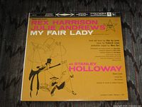 Front cover showing title, artists and yellow artwork