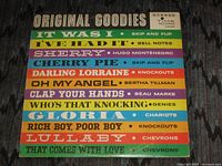 Front cover displaying album title, coloured stripes with artists and songs