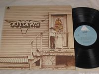 Front jacket artwork and vinyl record showing label side A