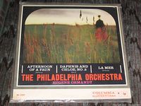 Front cover showing sealed LP with artwork and titles