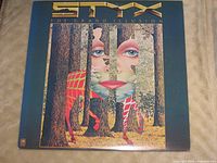 Front cover of Styx The Grand Illusion LP