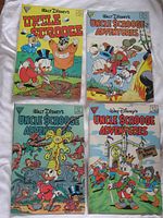 All four comic front covers displayed