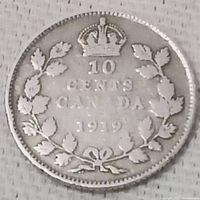 Reverse side of 1919 Canadian silver 10 cent coin showing denomination, country, and year surrounded by a maple leaf wreath and crown.