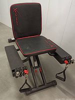 Front view of Total Flex exercise bench with padded seat and backrest, resistance bands and handles attached.