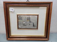 Full view of framed sterling silver country scene with wood and gold trim frame
