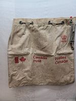 Full front view of vintage 1978 Canada Post mail bag showing Canadian flag, bilingual text, and crown emblem with year.