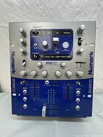 Top view of Numark DXM06 2-Channel Digital DJ Mixer showing main controls and effects section.