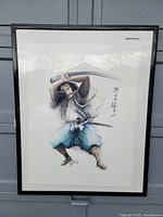 Full view of the framed watercolour showing the samurai figure and Japanese script on the side.