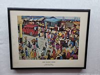 Framed art print showing the entire image of the busy marketplace titled 'Bazar Du Quai, Port-au-Prince, Haiti' by Lois Mailou Jones.