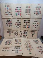 Overview of approximately twenty-plus album pages showing German stamps mounted on sheets