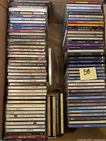 Photo showing a large stack of CDs with visible spines and titles of blues, jazz and soul artists