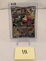 Photo of front side of Fuecoco #201 Paldea Evolved Pokemon card showing artwork and card details.