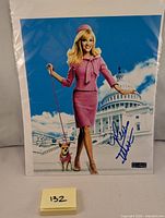Signed Reese Witherspoon Legally Blonde photo with signature and visible COA sticker.