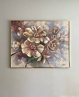 Front view of large floral oil painting on canvas framed in gold-tone frame.