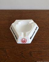 Top angled view showing the white Opalex glass ashtray with Montreal 1976 text and red Olympic logo.