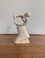 Front and side views of the vintage ceramic/plaster abstract human figurine, highlighting shape, texture, and details.