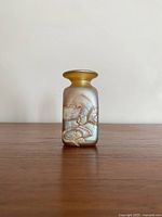 Front view of the vintage iridescent art glass vase showing abstract textured pattern on cylindrical body.