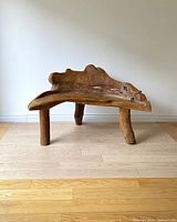 Front view of bench showing live edge seat and backrest