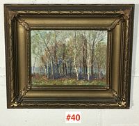 Framed painting displayed on wall, full view