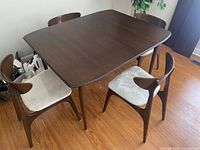 Overall view of table set assembled with chairs around.