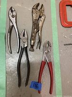 Four pliers and vice grips laid flat on surface for condition and detail examination.