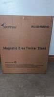 Box of the Sportneer Magnetic Bike Trainer Stand with branding and product name clearly visible.