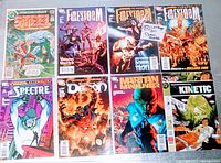 Photo of all 8 vintage DC comic books laid out on a surface showing front covers including Steel, Firestorm (x3), Spectre, Demon, Martian Manhunter, and Kinetic comics.