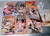 Image showing full layout of all seven Wonder Woman DC Comics in lot, various covers from 2005-2006 featuring different artistic styles and characters