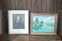 Overview of framed Tennyson portrait print and landscape painting