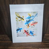 Colorful koi fish print with several koi in red, blue, orange, and yellow colors, matted, shrink-wrapped