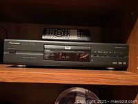 Front view of Pioneer DVD player DV-343 with remote on top