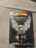 Front of sealed Harley-Davidson SkyBox trading card set box showing eagle and Harley-Davidson logo with a sticker indicating inclusion of custom patch.