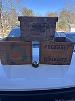 Photo showing all three wooden boxes together on a white surface.