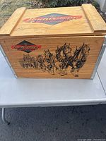 Full side view showing Budweiser Clydesdales horse team on the box side with metal corner supports.