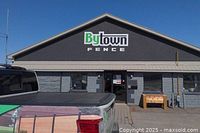 Front exterior of Bytown Fence showroom with company signage and branded truck bed visible