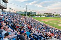 Crowd view of filled Club level seating and the baseball field at RCGT Park