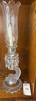 Full assembled view of crystal hurricane lamp with shade and prisms on base