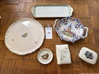 Overview of all six pieces laid out on parquet floor