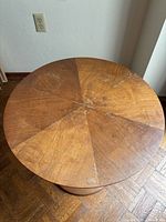 Top view showing radial eight-piece veneer pattern and surface wear