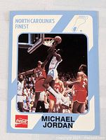 Front of 1989 Michael Jordan college basketball card showing action photo and branding.