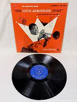 Photo of the front of the album cover and vinyl record with blue Columbia label.