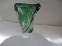 Front view of green crystal wave vase on white background