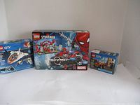 Photo showing the three LEGO boxed sets including Spider-Man and LEGO City sets