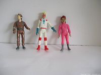 Three Ghostbuster action figures against white background.