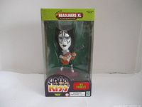 Front view of the Ace Frehley KISS Headliners XL figure inside the original box, showing the figure with guitar and KISS branding.