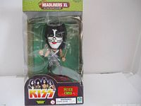 Front view of the Peter Criss figurine from KISS in original packaging showing the box and figure clearly.